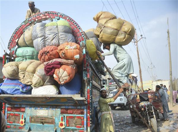 More than 400,000 Afghans return home from Pakistan following crackdown on migrants